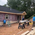 Putting up siding during Women Build 2021